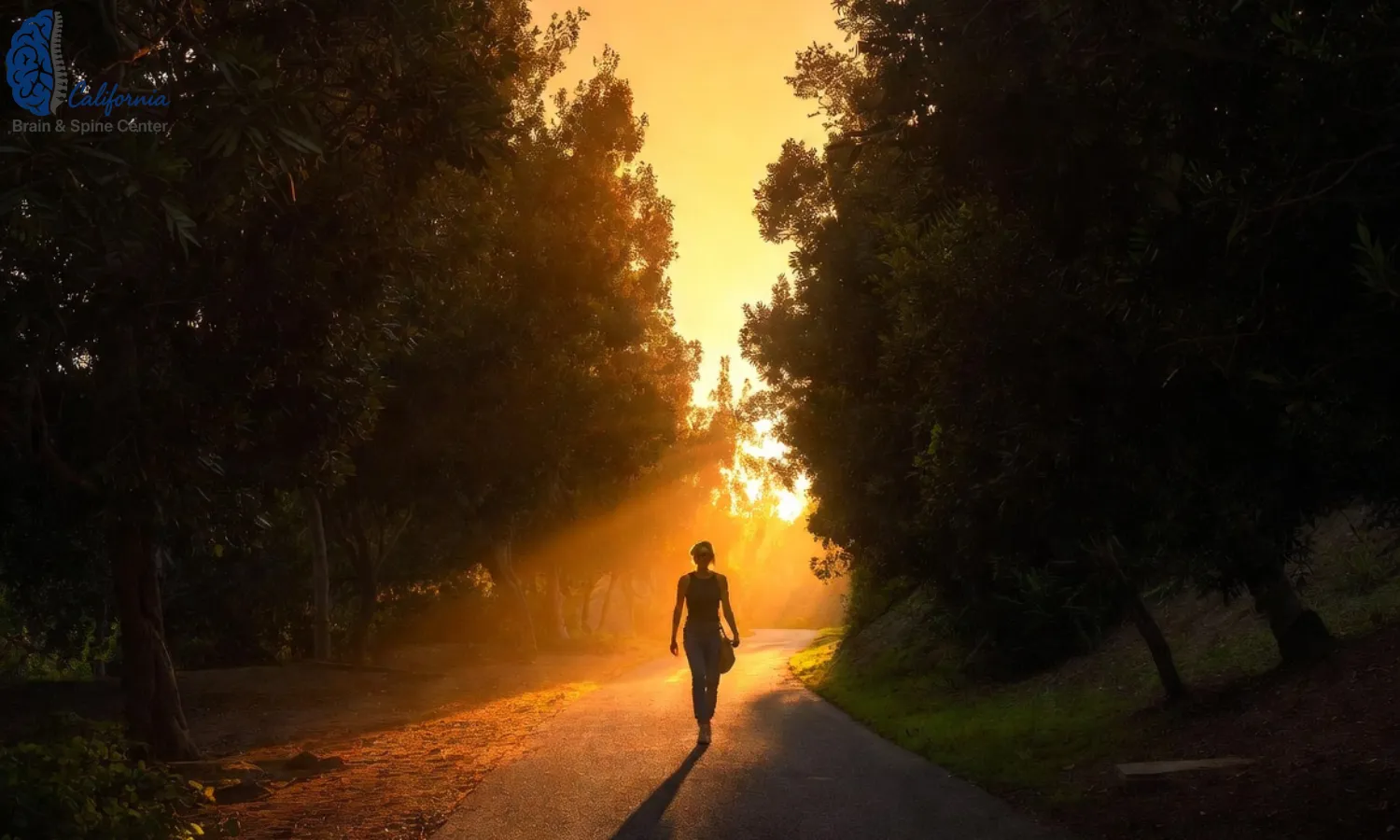 Hidden Hills resident walking calmly on a tree lined path at sunset, looking relaxed and balanced, subtle hint of nearby hills and residential homes, representing recovery and confidence.