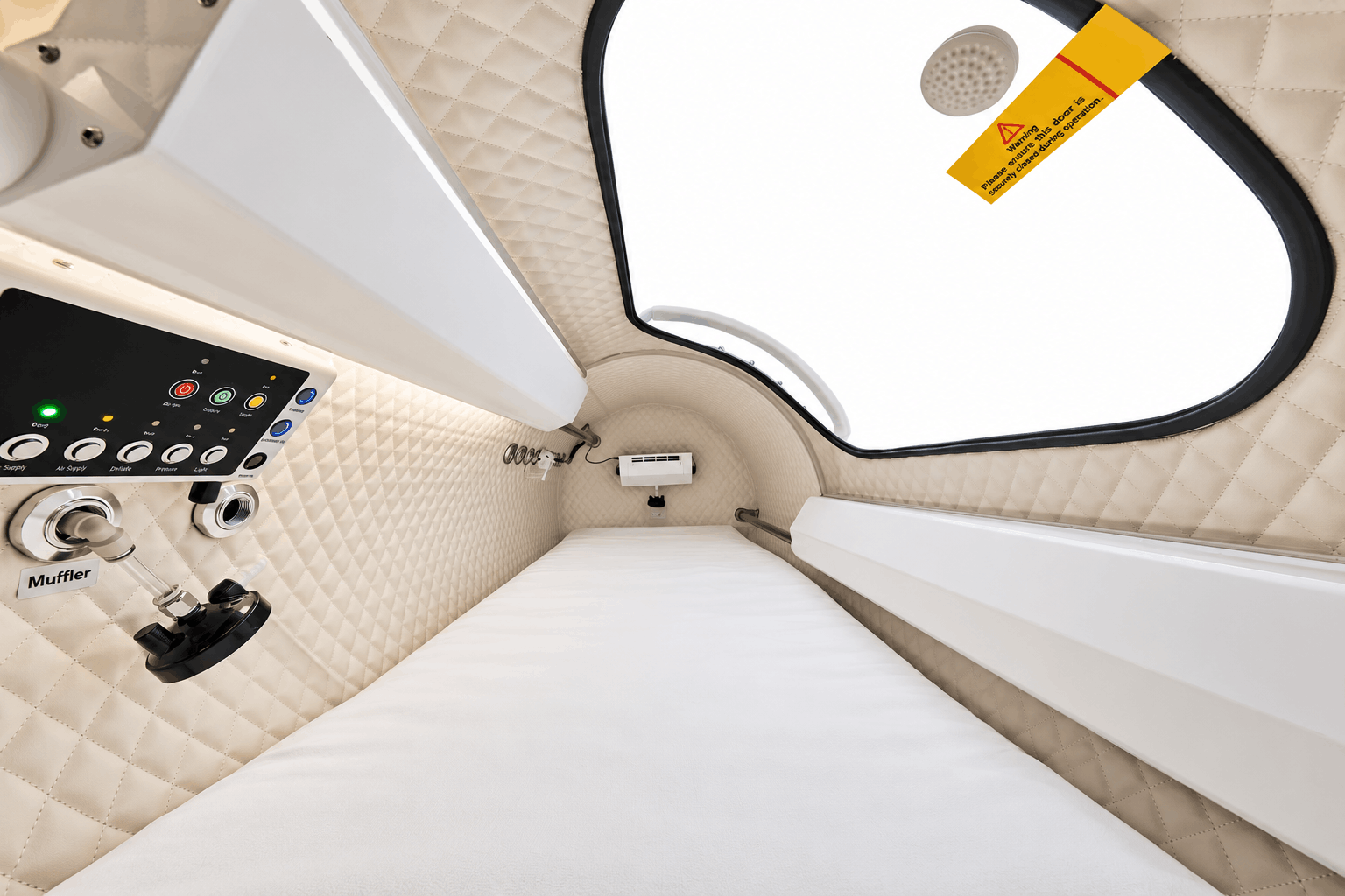 Adult patient talking with a clinician about hyperbaric oxygen screening in a consultation room